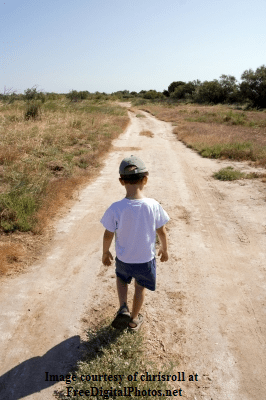 Boy Walking down road